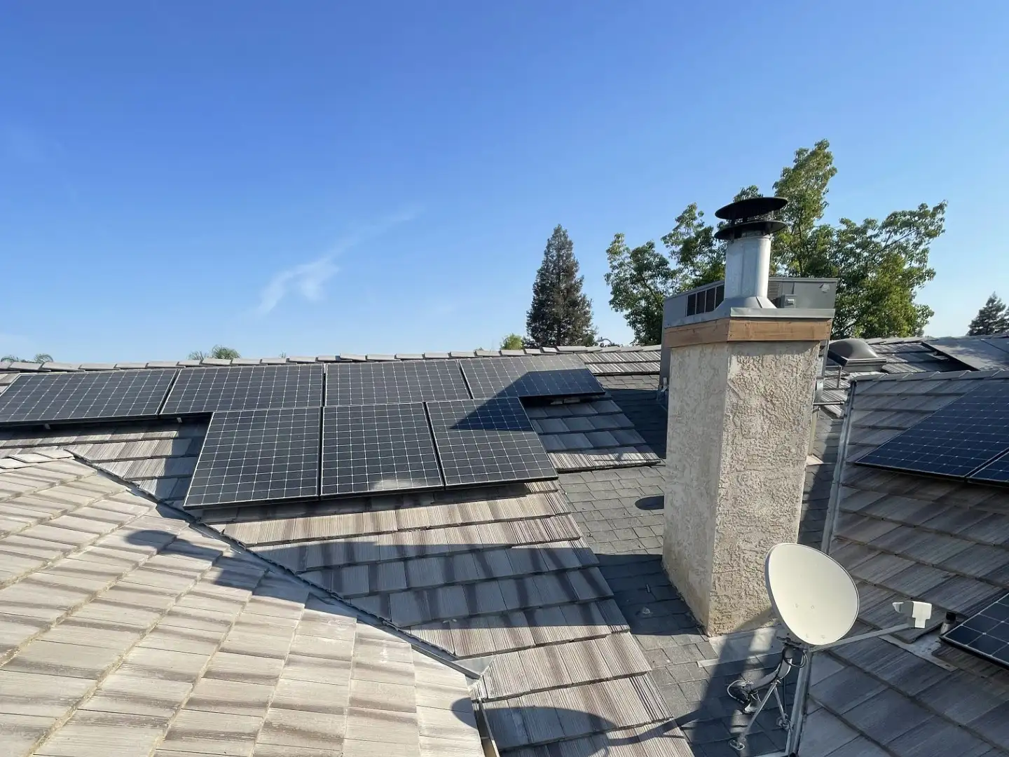 Replaced damaged tiles on roof with solar panel and chimney